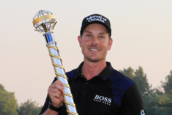 Henrik Stenson from Sweden holds the trophy of the DP World Golf Championship