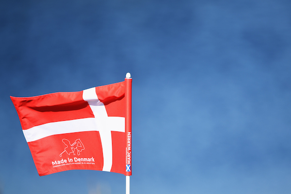 AALBORG, DENMARK - AUGUST 19:  A Danish hole flag flys with the name of last year's winner Marc Warren of Scotland on the side during the Pro - Am prior to the start of the Made in Denmark golf at Himmerland Golf & Spa Resort on August 19, 2015 in Aalborg, Denmark.  (Photo by Stuart Franklin/Getty Images)